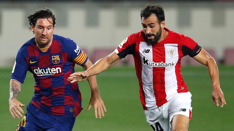 Lionel Messi and Athletic Bilbao's Mikel Balenziaga battle for possession