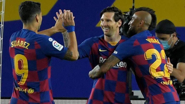 Barcelona's Argentine forward Lionel Messi (C) celebrates with teammates after scoring a penalty during the Spanish league football match FC Barcelona against CD Leganes at at the Camp Nou stadium in Barcelona on June 16, 2020. (Photo by LLUIS GENE / AFP) (Photo by LLUIS GENE/AFP via Getty Images)