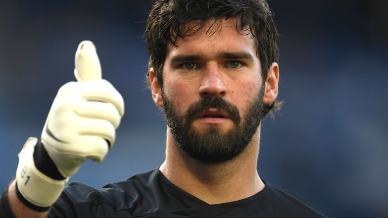 Alisson Becker of Liverpool shows a thumbs up
