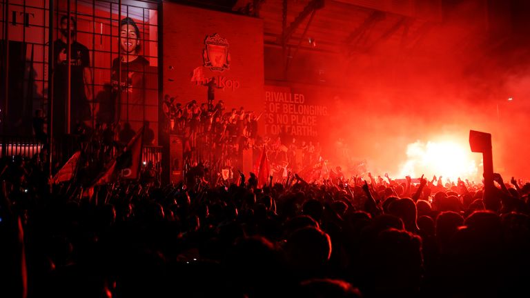Liverpool fans let off flares outside Anfield