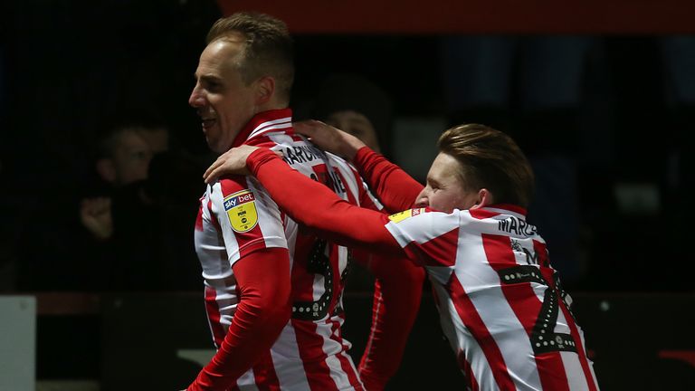 Luke Varney of Cheltenham Town celebrates with team mate Alfie May after scoring his sides second goal during the Sky Bet League Two match between Cheltenham Town and Northampton Town 