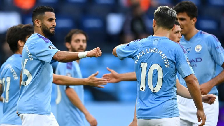 Riyad Mahrez celebrates with team-mates