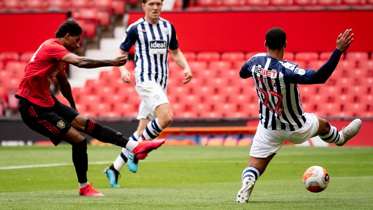 Marcus Rashford shoots during the first friendly game with West Brom