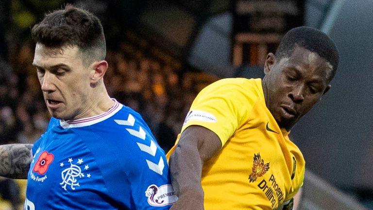 Marvin Bartley (right) challenges Rangers' Ryan Jack