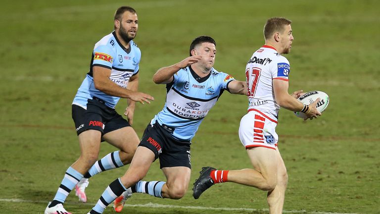 Matt Dufty runs the ball  for the Dragons