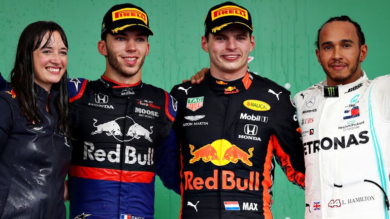 Top three finishers Max Verstappen of Netherlands and Red Bull Racing, Pierre Gasly of France and Scuderia Toro Rosso and Lewis Hamilton of Great Britain and Mercedes GP celebrate on the podium during the F1 Grand Prix of Brazil at Autodromo Jose Carlos Pace on November 17, 2019 in Sao Paulo, Brazil. 