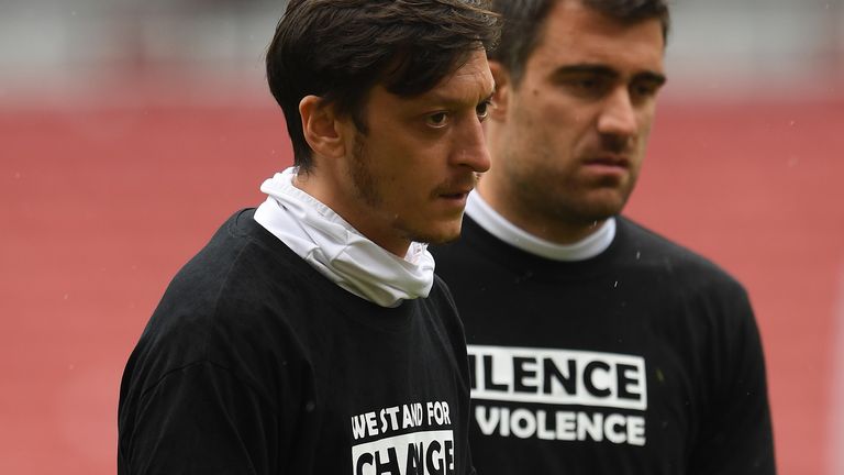 Mesut Ozil of Arsenal warms up at half time during the friendly match between Arsenal and Brentford at Emirates Stadium