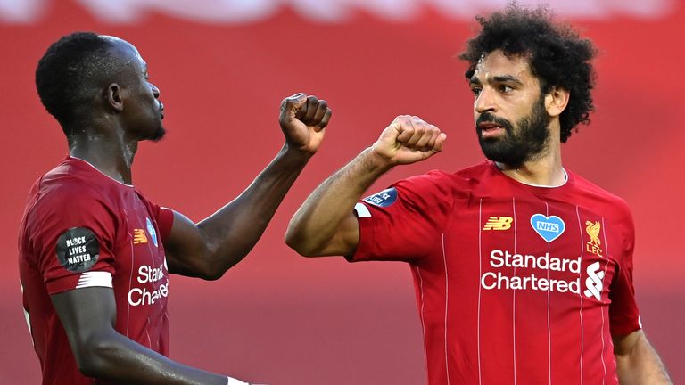 Mohamed Salah celebrates with Sadio Mane after scoring Liverpool's second goal against Crystal Palace