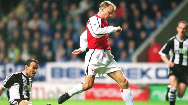 Dabizas is beaten as Bergkamp composes himself to fire at goal