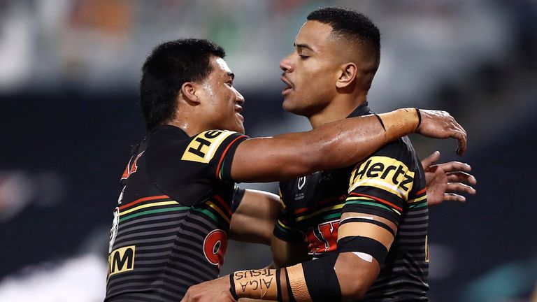 SYDNEY, AUSTRALIA - JUNE 19: Stephen Crichton (R) of the Panthers celebrates with team mates after scoring a try during the round six NRL match between the Penrith Panthers and the Melbourne Storm at Campbelltown Stadium on June 19, 2020 in Sydney, Australia. (Photo by Ryan Pierse/Getty Images)