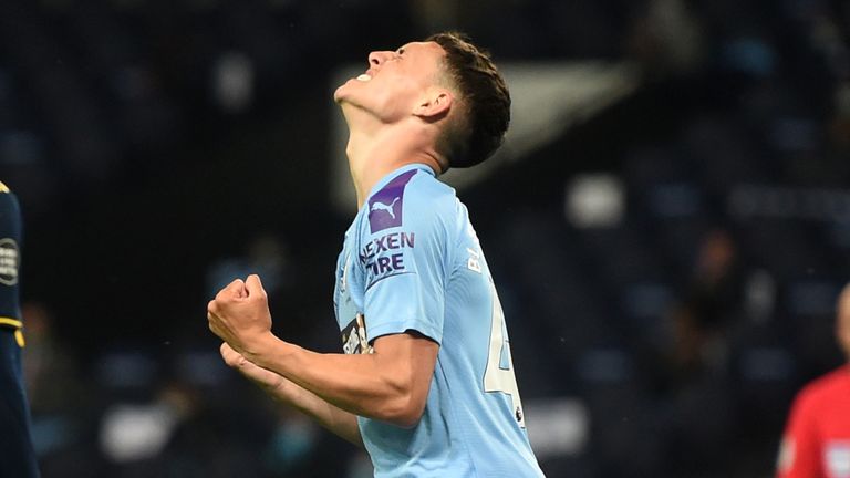Phil Foden celebrates after scoring Manchester City&#39;s third goal against Arsenal