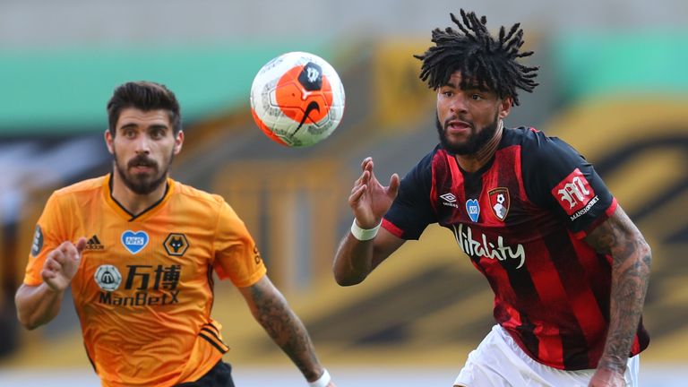 Philip Billing of AFC Bournemouth battles for possession with Ruben Neves of Wolverhampton Wanderers