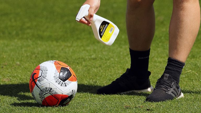 A Premier League call is sprayed with disinfectant during training