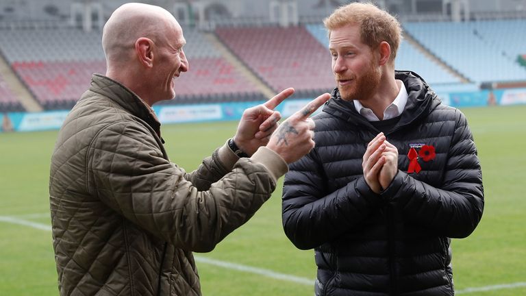 Prince Harry, Duke of Sussex speaks with former Wales rugby captain, Gareth Thomas (L) during a Terrence Higgins Trust event ahead of National HIV Testing Week at Twickenham Stoop on November 08, 2019 in London, England.