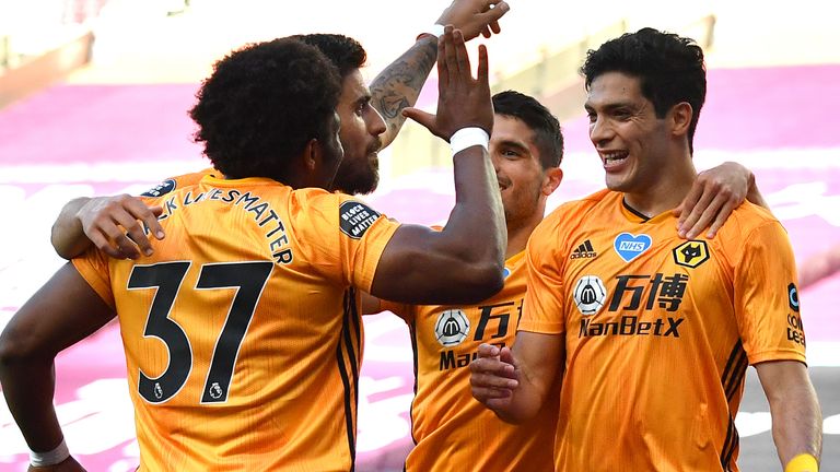 Raul Jimenez celebrates with team-mates after scoring Wolves' opening goal against West Ham