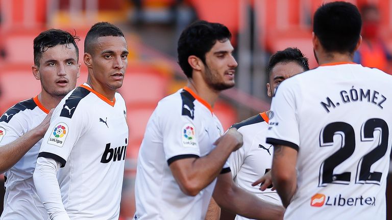 Goncalo Guedes (centre) scored and assisted Valencia's two goals on Sunday