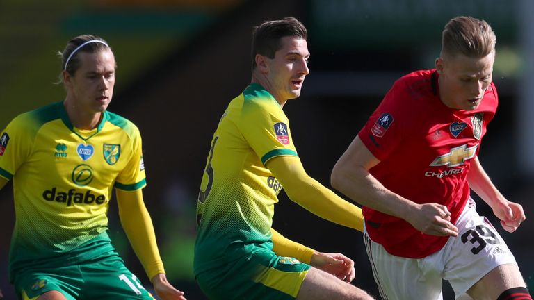 Scott McTominay takes on Kenny McLean