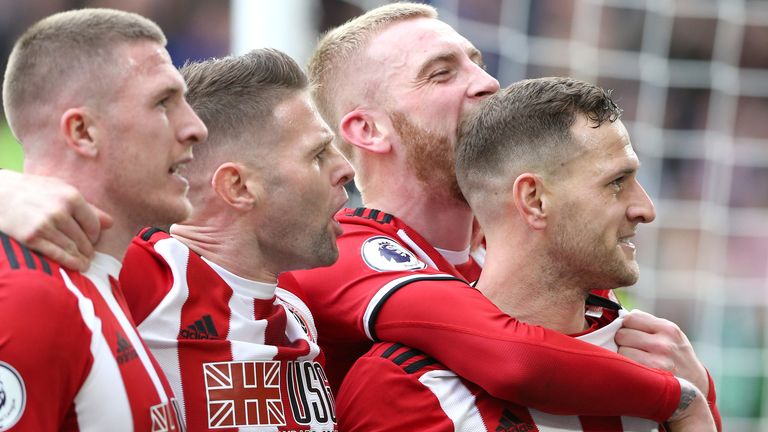 Oliver Norwood (second from left) and Billy Sharp (far right) have signed new deals with Sheffield United