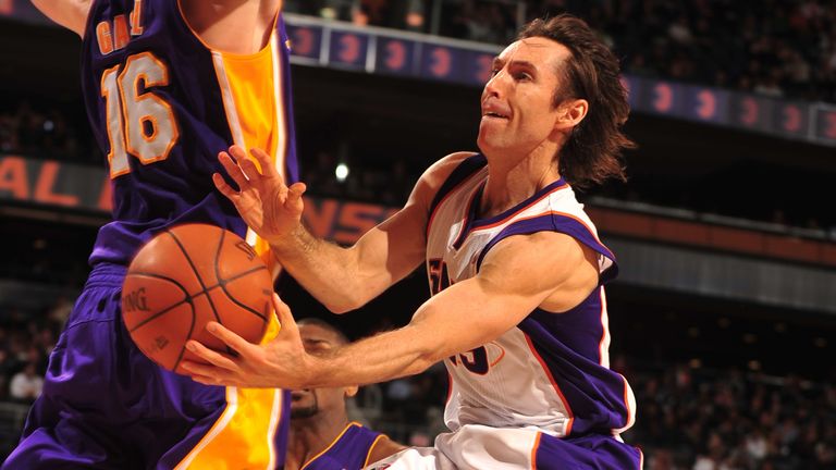 Steve Nash goes airborne to throw a wraparound pass against the Lakers