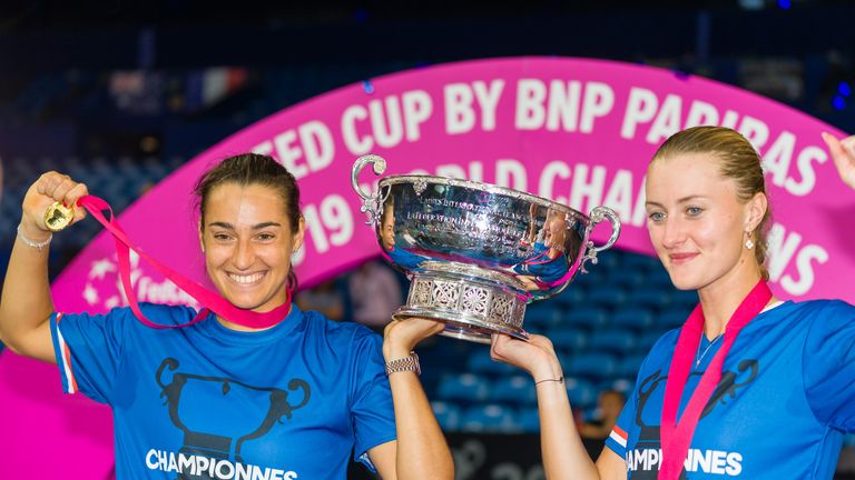 Team France's Kristina Mladenovic and Caroline Garcia hold the Fed Cup trophy after their victory in the final over Australia in 2019