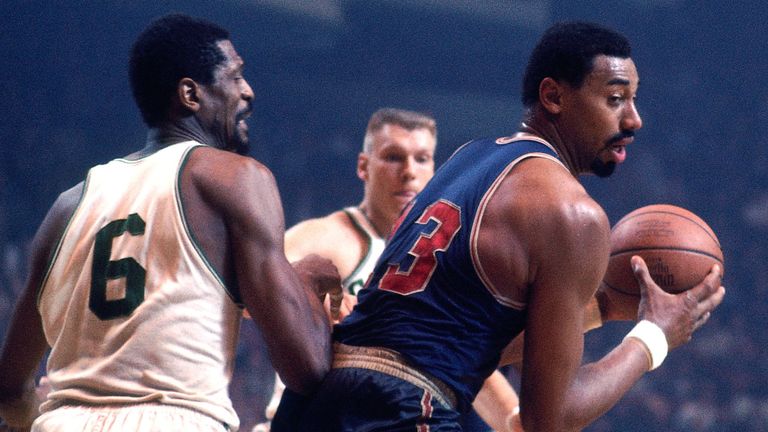 Wilt Chamberlain posts up against arch-rival Bill Russell