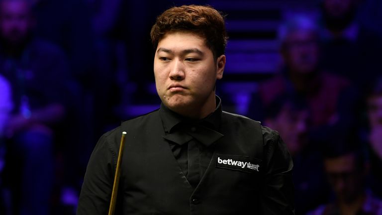 Yan Bingtao reacts after his match against John Higgins in the Quater Final of the Betway UK Championship at The Barbican on December 06, 2019 in York, England. 