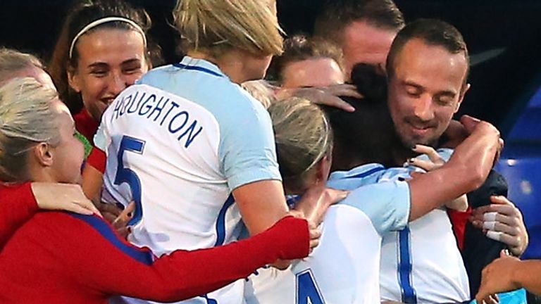 Nikita Parris hugs Mark Sampson following her goal against Russia in 2017