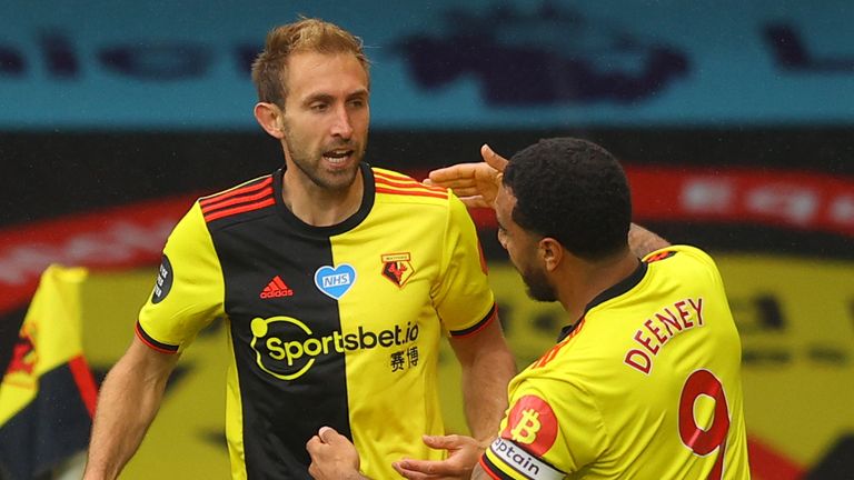 Craig Dawson and Troy Deeney celebrate Watford's opening goal against Norwich.