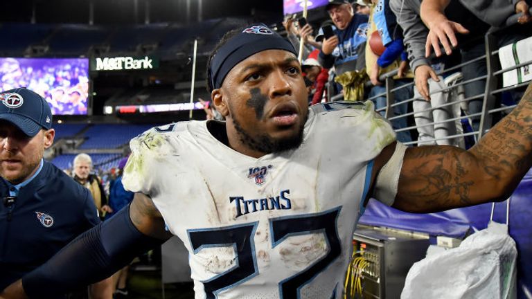 Derrick Henry of the Tennessee Titans celebrates with fans after defeating the Baltimore Ravens in the AFC Divisional Playoff
