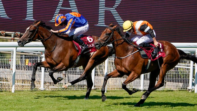 Ryan Moore riding Fancy Blue (left) to win the Qatar Nassau Stakes from Tom Marquand on One Voice