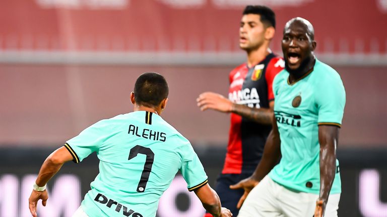 Alexis Sanchez of Inter (left) celebrates with his team-mate Romelu Lukaku after scoring a goal during the Serie A match between Genoa CFC and FC Internazionale at Stadio Luigi Ferraris on July 25, 2020 in Genoa, Italy.