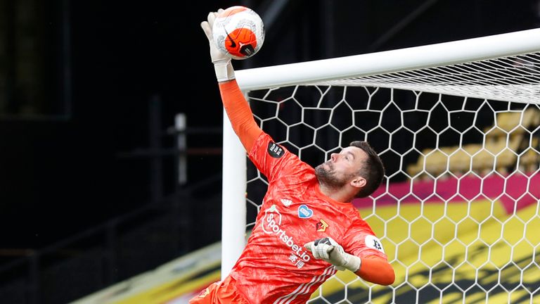 Ben Foster tips the ball over the bar against Man City