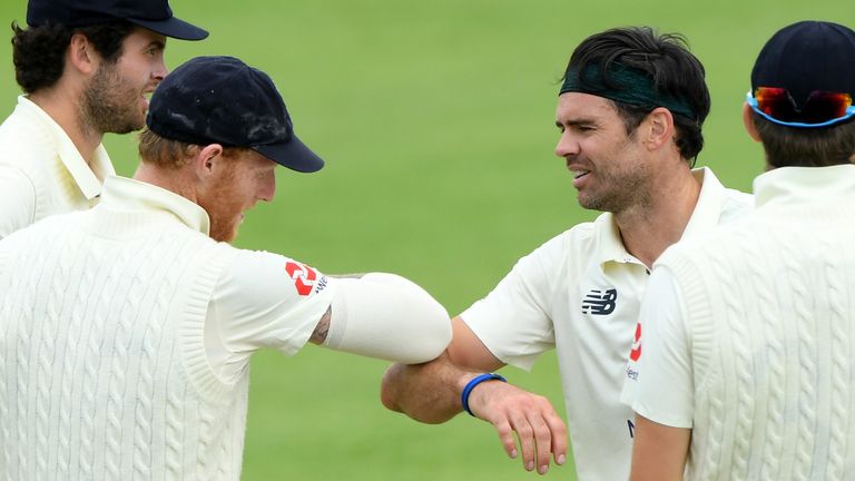 SOUTHAMPTON, ENGLAND - JULY 01: James Anderson of England 'elbow bumps' Ben Stokes after taking the wicket of Joe Denly of England during Day One of a England Warm Up Match at the Ageas Bowl on July 01, 2020 in Southampton, England. 