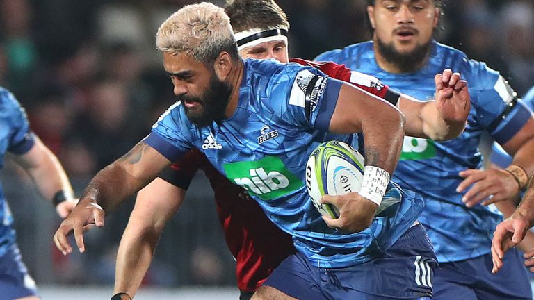 Akira Ioane of the Blues is tackled by Richie Mo'unga of the Crusaders
