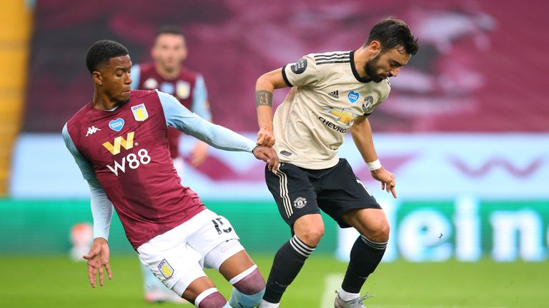 Bruno Fernandes of Manchester United is fouled by Ezri Konsa Ngoyo of Aston Villa to win a penalty kick during the Premier League match between Aston Villa and Manchester United at Villa Park on July 09, 2020 in Birmingham, England.