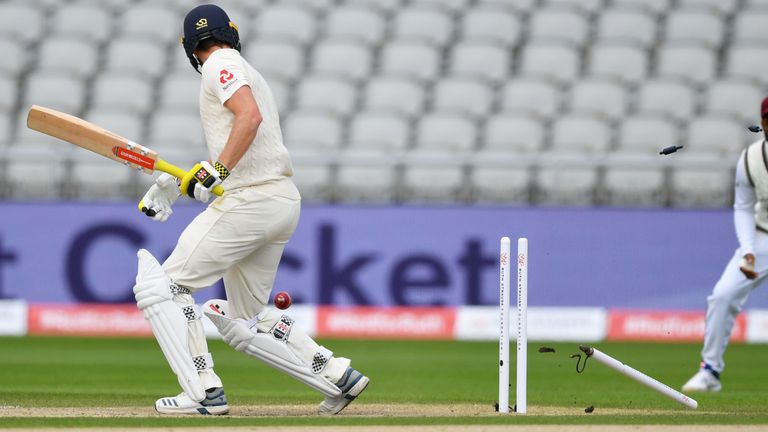 Chris Woakes is bowled by Kemar Roach