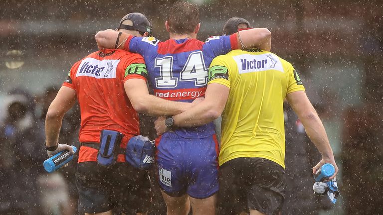 Connor Watson of the Knights is taken from the ground during the round 11 NRL match between the Newcastle Knights and the Canterbury Bulldogs at McDonald Jones Stadium on July 26, 2020 in Newcastle, Australia.