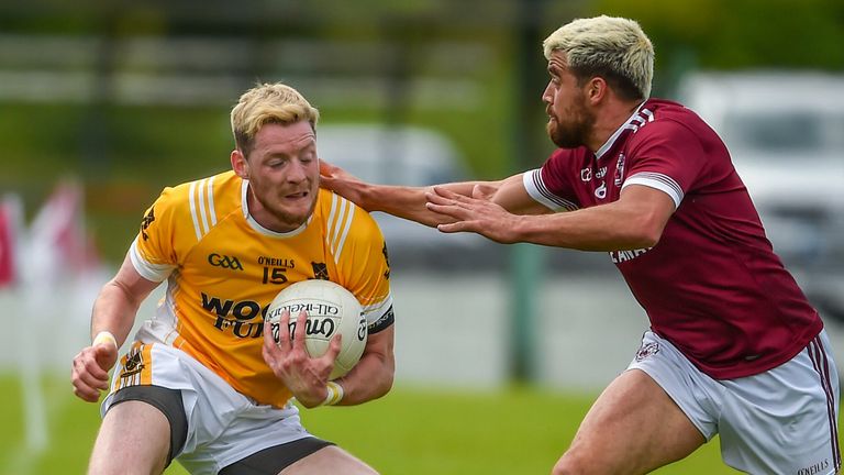 Conor McManus of Clontibret in action against Drew Wylie of Ballybay