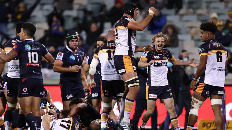 Darcy Swain celebrates after team mate Will Miller scores for the Brumbies