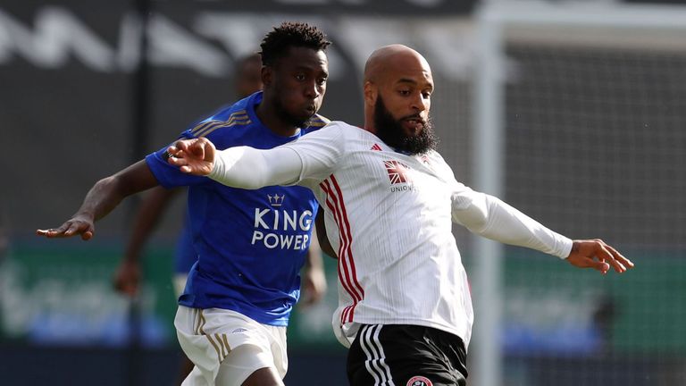 David McGoldrick tries to get away from Wilfred Ndidi during Leicester vs Sheffield United