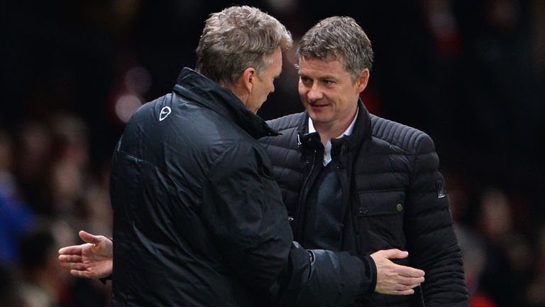Cardiff City Manager Ole Gunnar Solskjaer congratulates Manchester United Manager David Moyes at the end of the Barclays Premier League match between Manchester United and Cardiff City at Old Trafford on January 28, 2014 in Manchester, England.