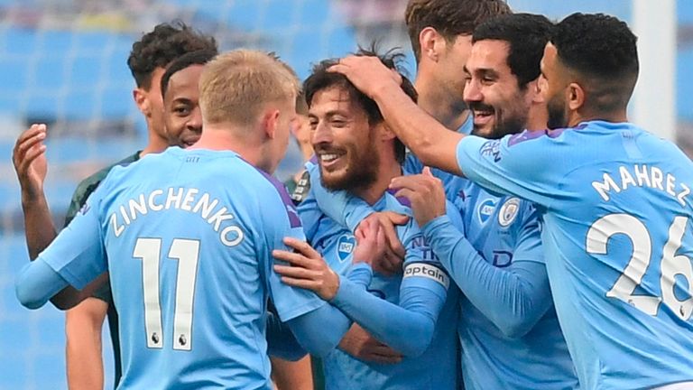Manchester City's Spanish midfielder David Silva (C) celebrates scoring their fourth goal during the English Premier League football match between Manchester City and Newcastle United at the Etihad Stadium in Manchester, north west England, on July 8, 2020