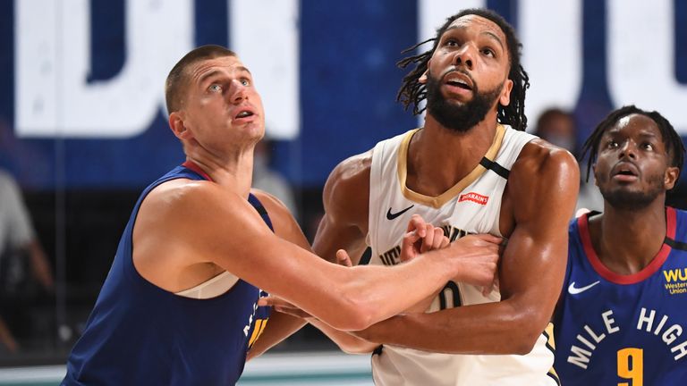 Nikola Jokic contests a rebound against the Pelicans