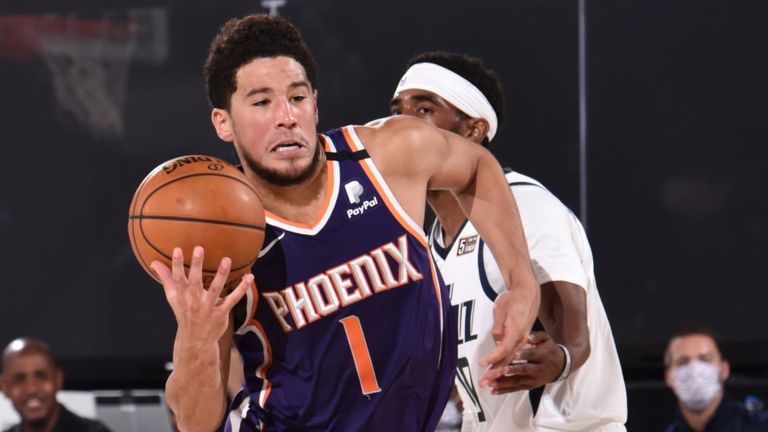 Devin Booker drives to the basket against the Utah Jazz