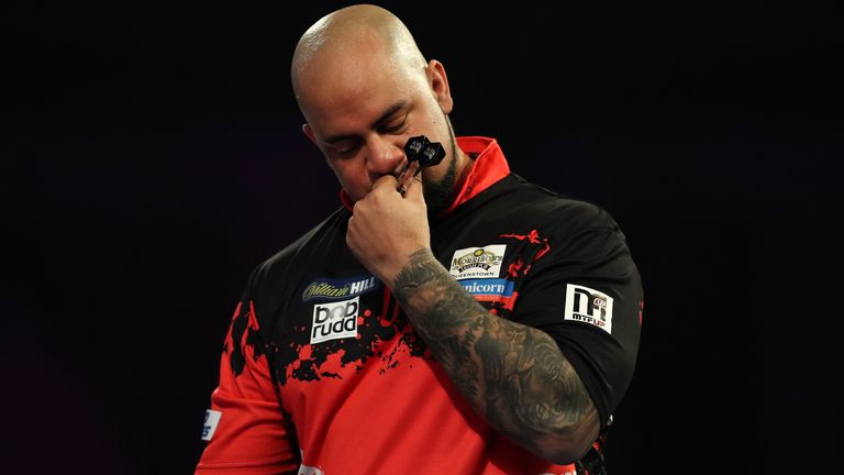 Devon Petersen of South Africa celebrates after winning his second round match against Ian White of England during Day Nine of the 2019 William Hill World Darts Championship at Alexandra Palace on December 21, 2018 in London, United Kingdom