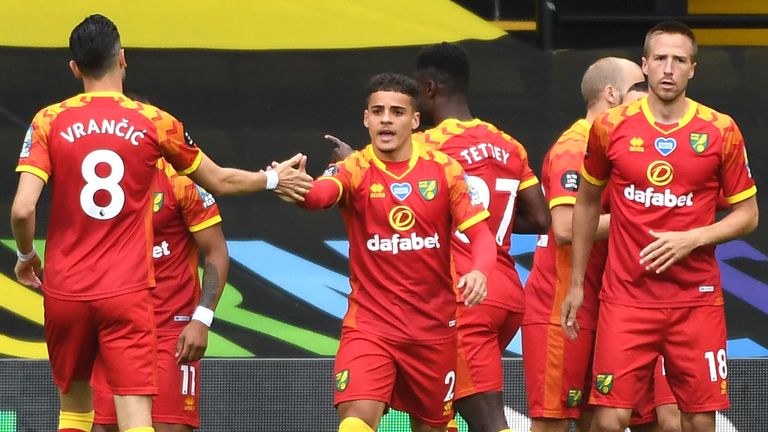 Emiliano Buendia of Norwich City celebrates with team-mates after scoring against Watford