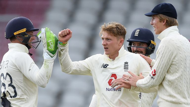 England's Dom Bess celebrates a wicket with Jos Buttler