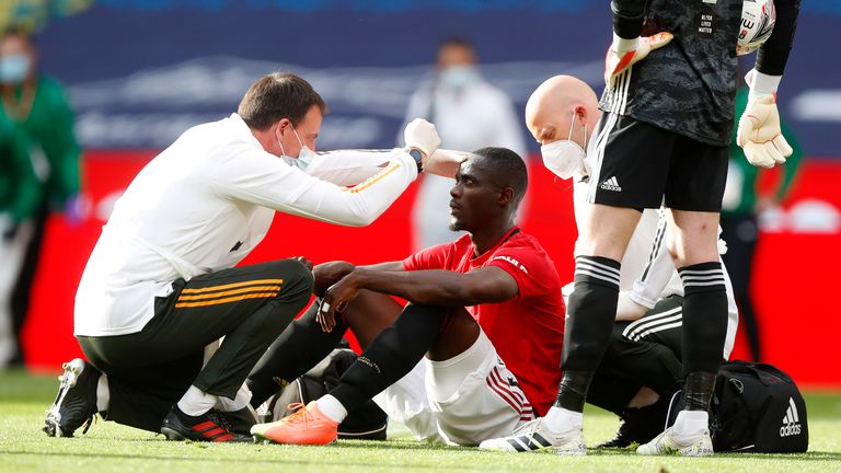  Eric Bailly of Manchester United is seen to by medical staff after a collision during the FA Cup Semi Final match between Manchester United and Chelsea at Wembley Stadium on July 19, 2020 in London, England. Football Stadiums around Europe remain empty due to the Coronavirus Pandemic as Government social distancing laws prohibit fans inside venues resulting in all fixtures being played behind closed doors. 