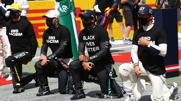 Drives take part in an anti-racism protest in support of the Black Lives matter movement prior to the Formula One Styrian Grand Prix race on July 12, 2020 in Spielberg, Austria.