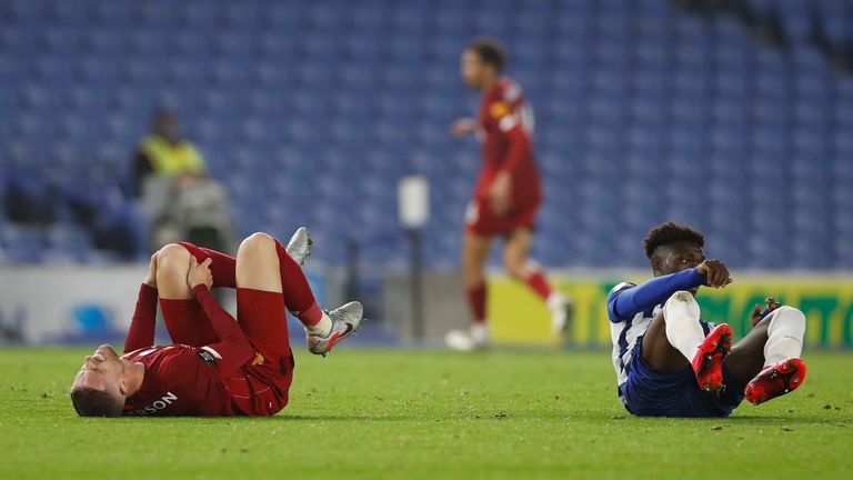 Jordan Henderson reacts after sustaining a knee injury against Brighton on Wednesday